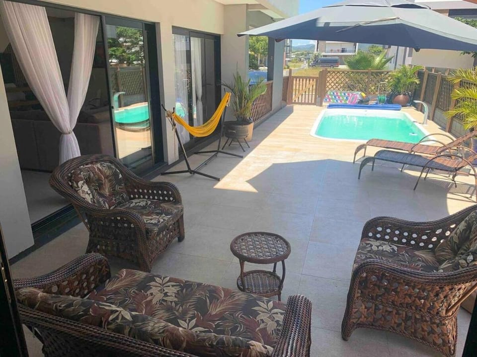 Patio, Day, Living room, Seating area, Pool view, Swimming pool, sunbed