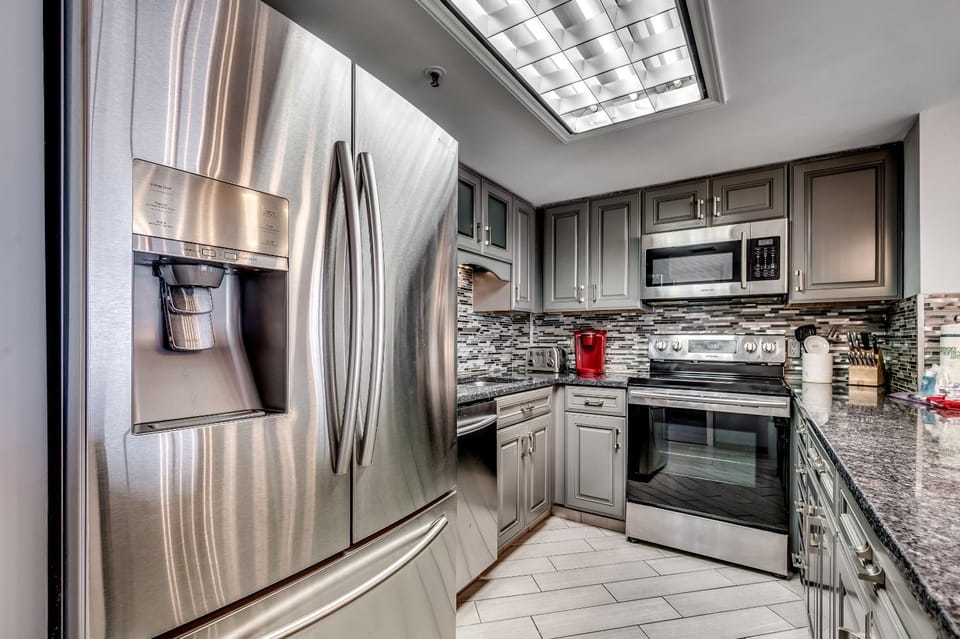 Kitchen or kitchenette, dishwasher, oven, stove, toaster