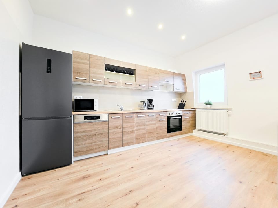 Kitchen or kitchenette, dishwasher, oven, stove