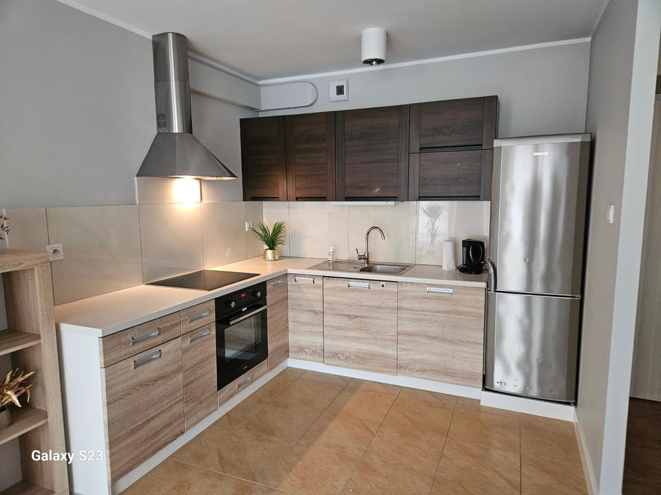 Kitchen or kitchenette, dishwasher, oven, stove