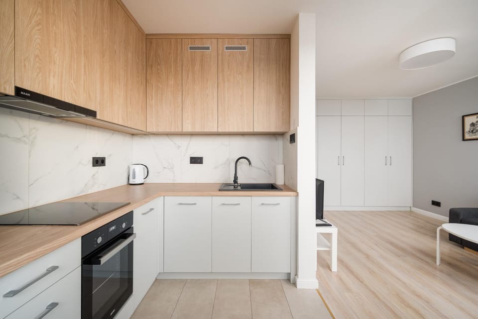 Kitchen or kitchenette, dishwasher, oven, stove