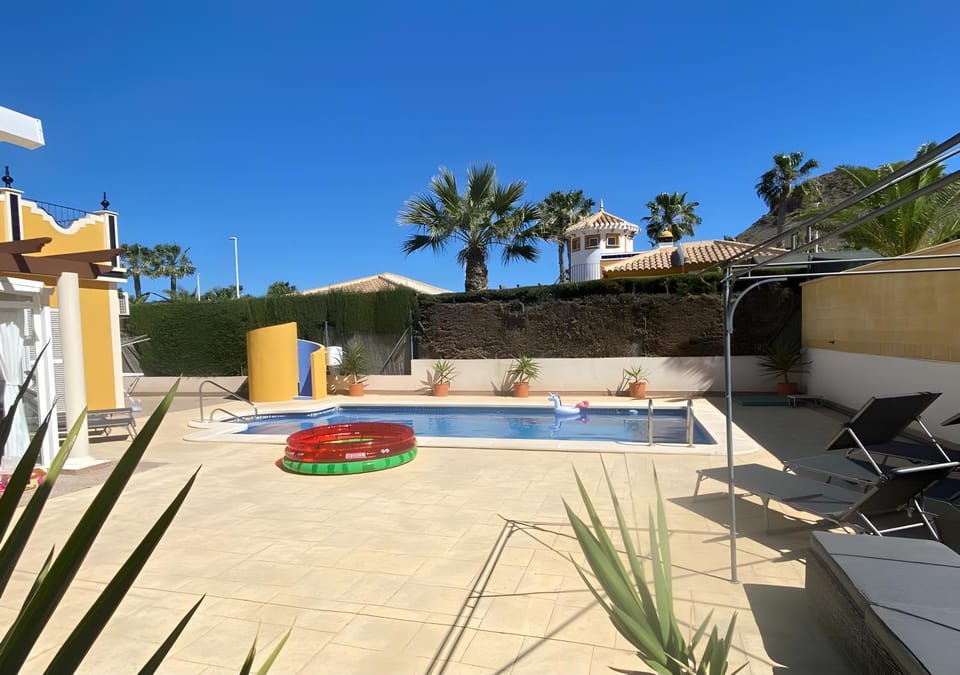 Property building, Living room, Swimming pool