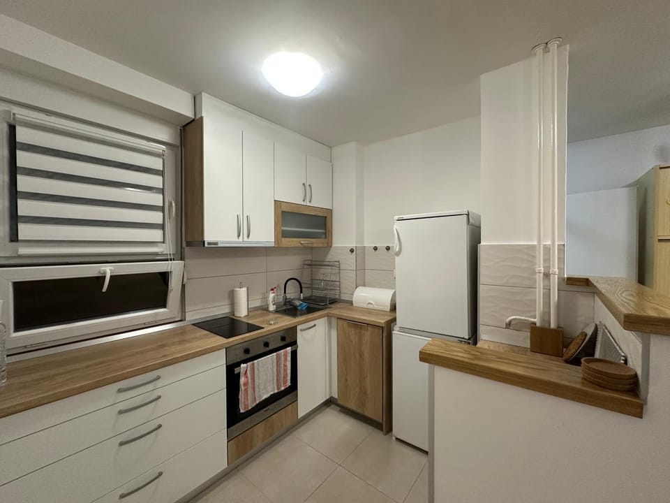 Kitchen or kitchenette, dishwasher, oven, stove, toaster
