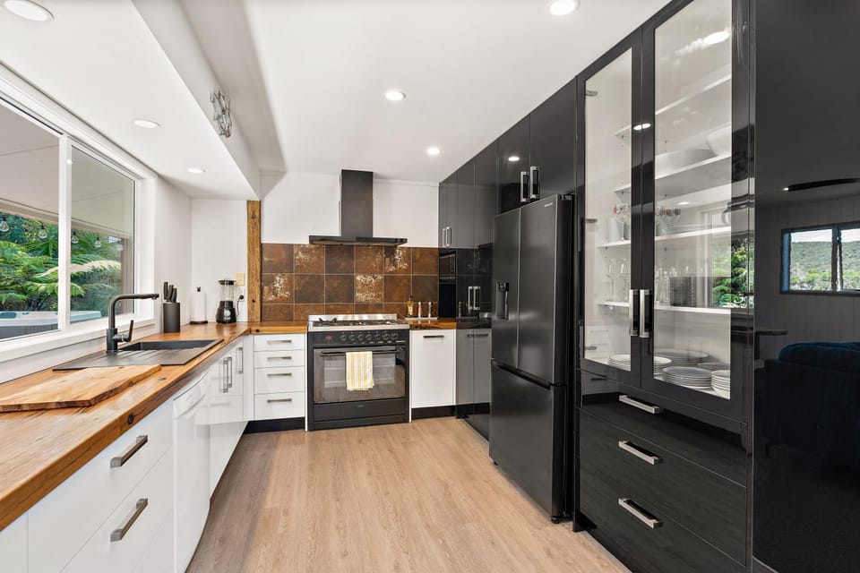 Kitchen or kitchenette, dishwasher, oven, stove, toaster