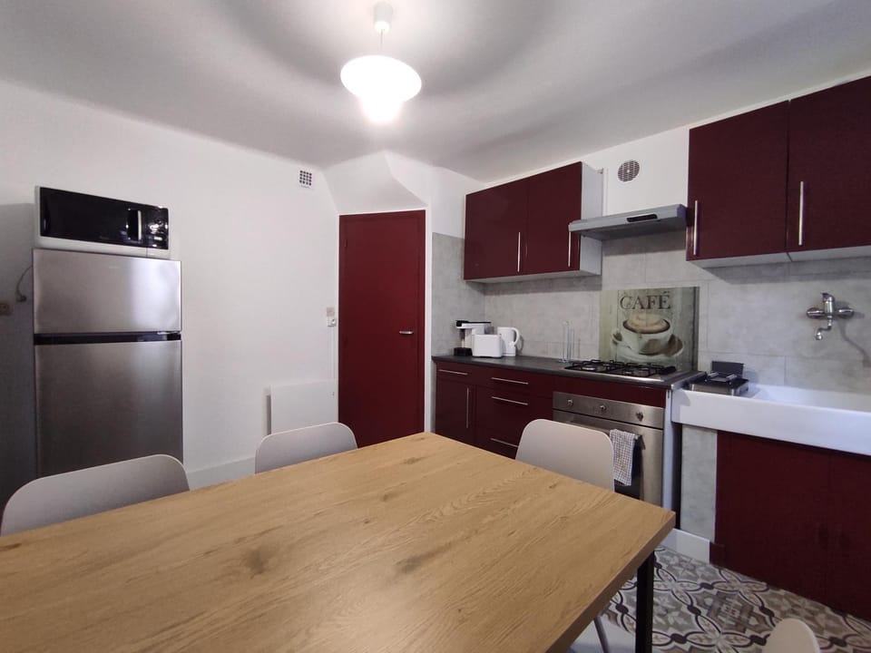 Dining area, microwave, stove, toaster, kitchen