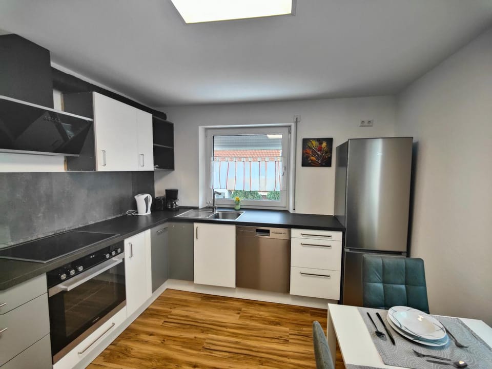 Kitchen or kitchenette, dishwasher, oven, stove, toaster