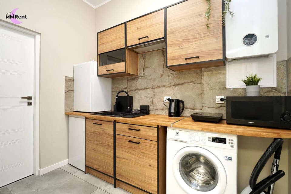 Kitchen or kitchenette, stove, washing machine