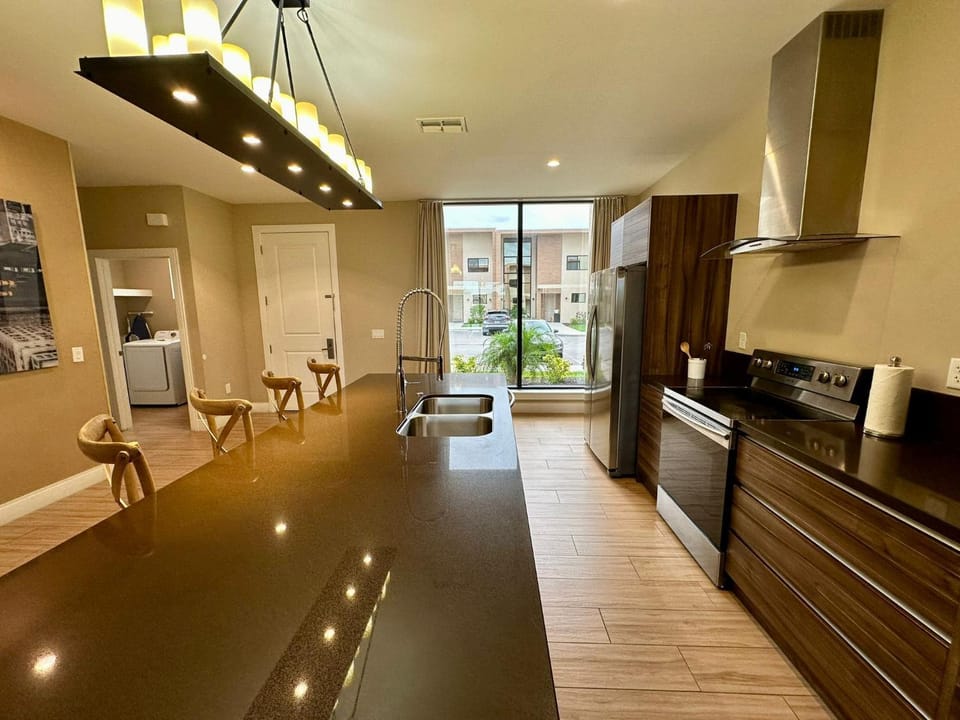 Kitchen or kitchenette, dishwasher, oven, stove, toaster