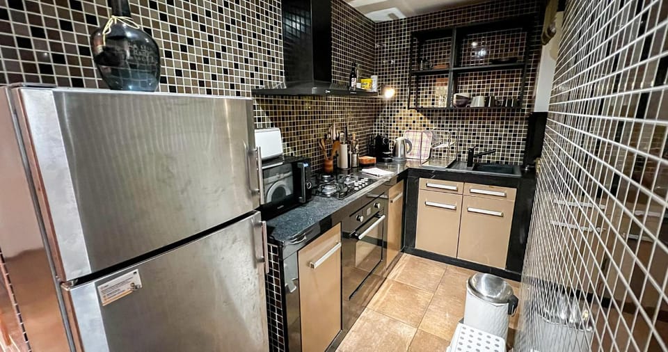 Kitchen or kitchenette, oven, stove, toaster