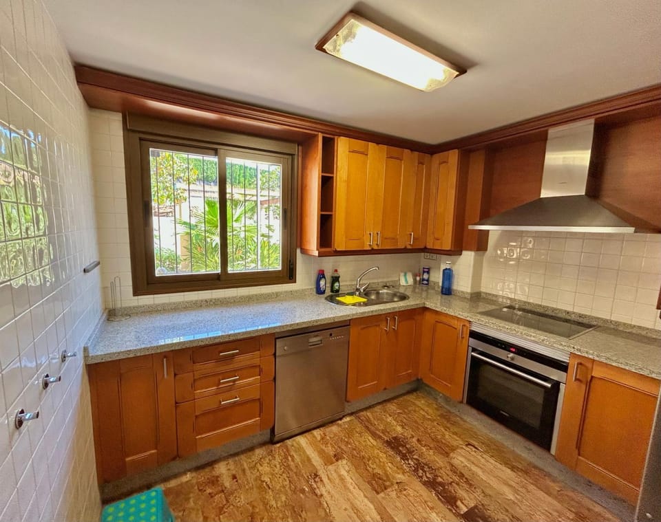 Kitchen or kitchenette, dishwasher, oven, stove