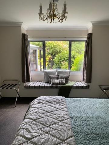Bed, Seating area, Bedroom