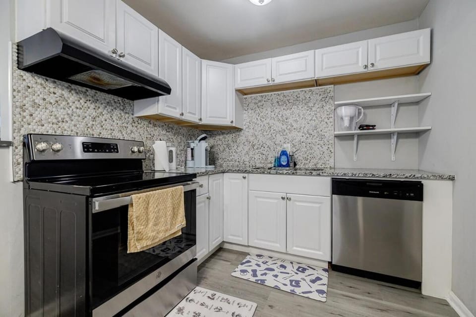 Kitchen or kitchenette, dishwasher, oven, stove, toaster