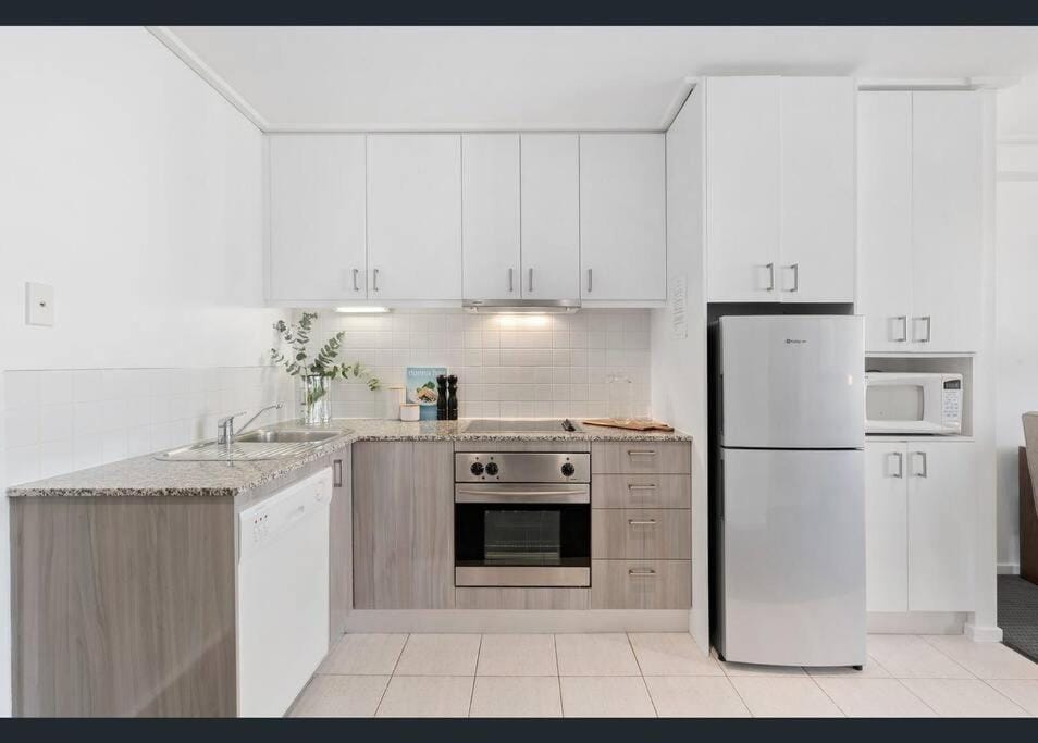 Kitchen or kitchenette, dishwasher, oven, stove, toaster