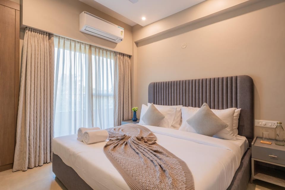 Bed, Photo of the whole room, Bedroom, towels, air conditioner