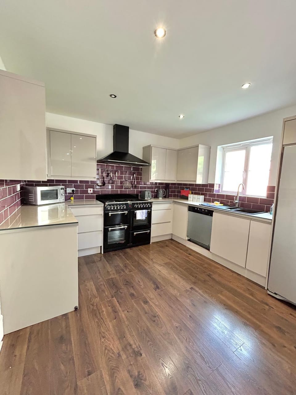 Kitchen or kitchenette, dishwasher, oven, stove, toaster