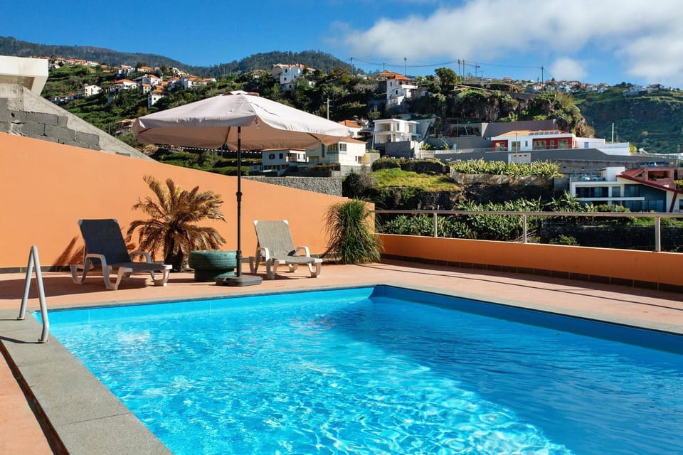 Property building, Living room, Swimming pool