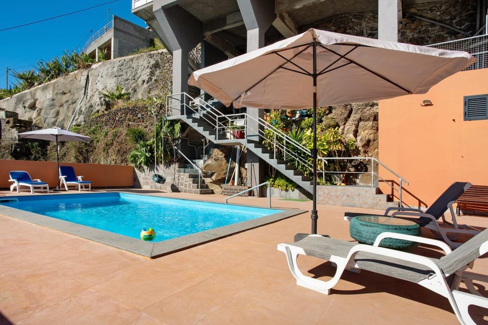 Property building, Living room, Swimming pool