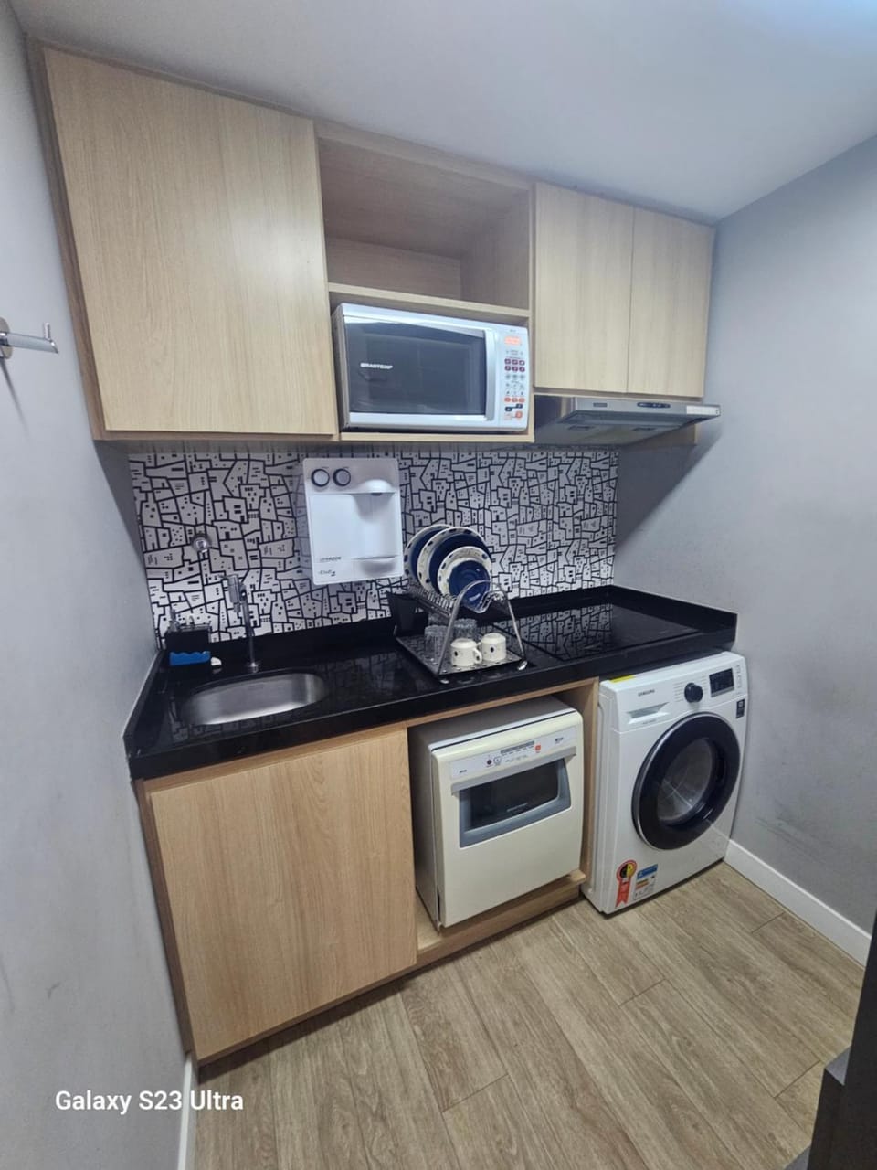 Kitchen or kitchenette, dishwasher, stove, toaster, washing machine, dryer