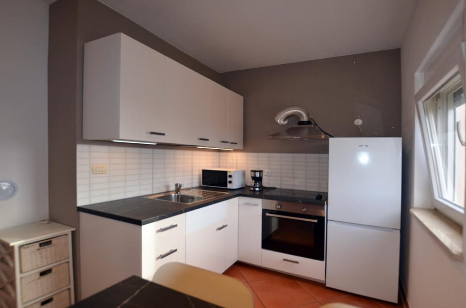 Kitchen or kitchenette, oven, stove, toaster