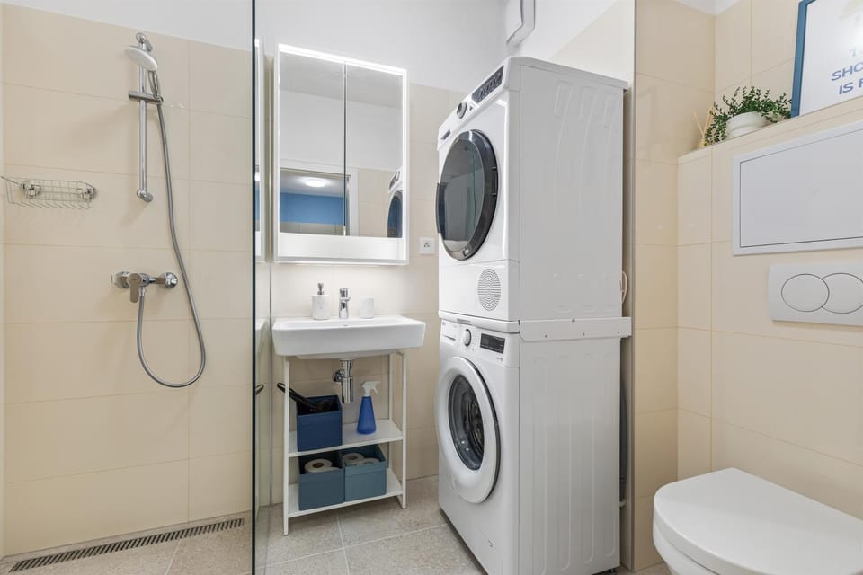 Shower, Toilet, Bathroom, towels, washing machine, dryer