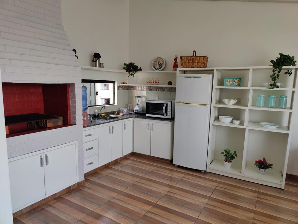 Kitchen or kitchenette, microwave, oven, stove