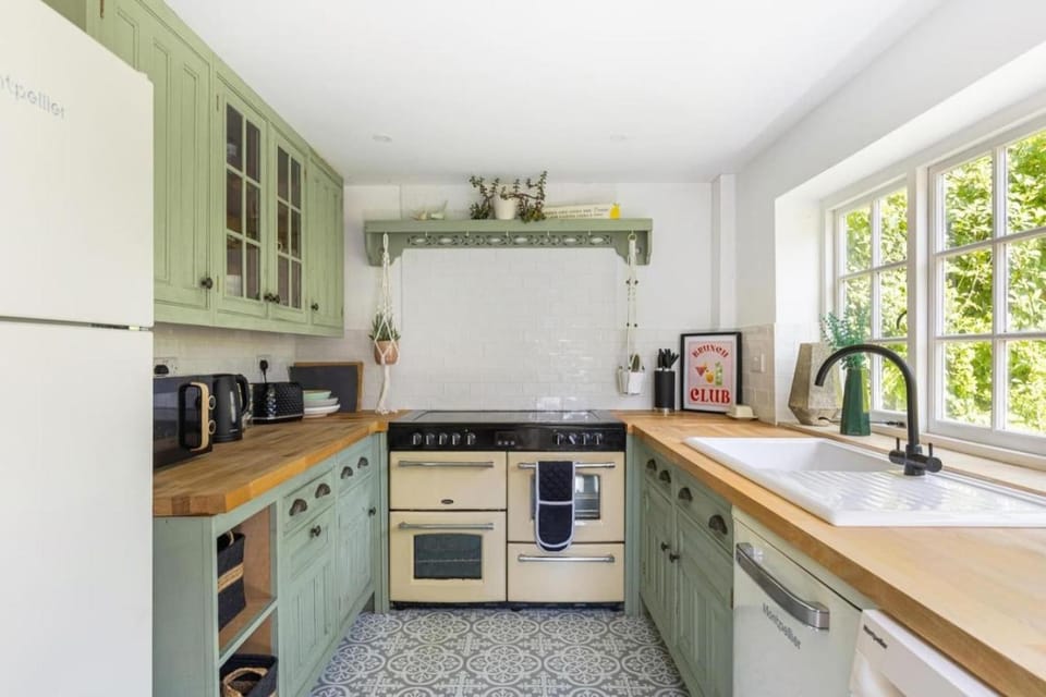 Kitchen or kitchenette, dishwasher, oven, stove, toaster
