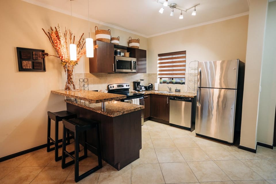 Kitchen or kitchenette, dishwasher, oven, stove, toaster
