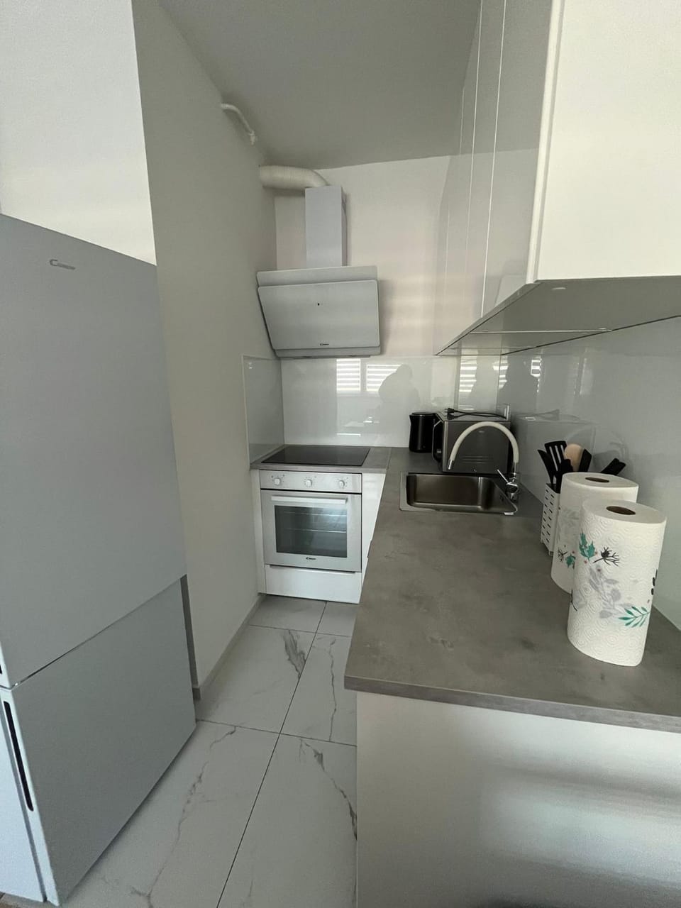 Kitchen or kitchenette, dishwasher, microwave, oven, stove