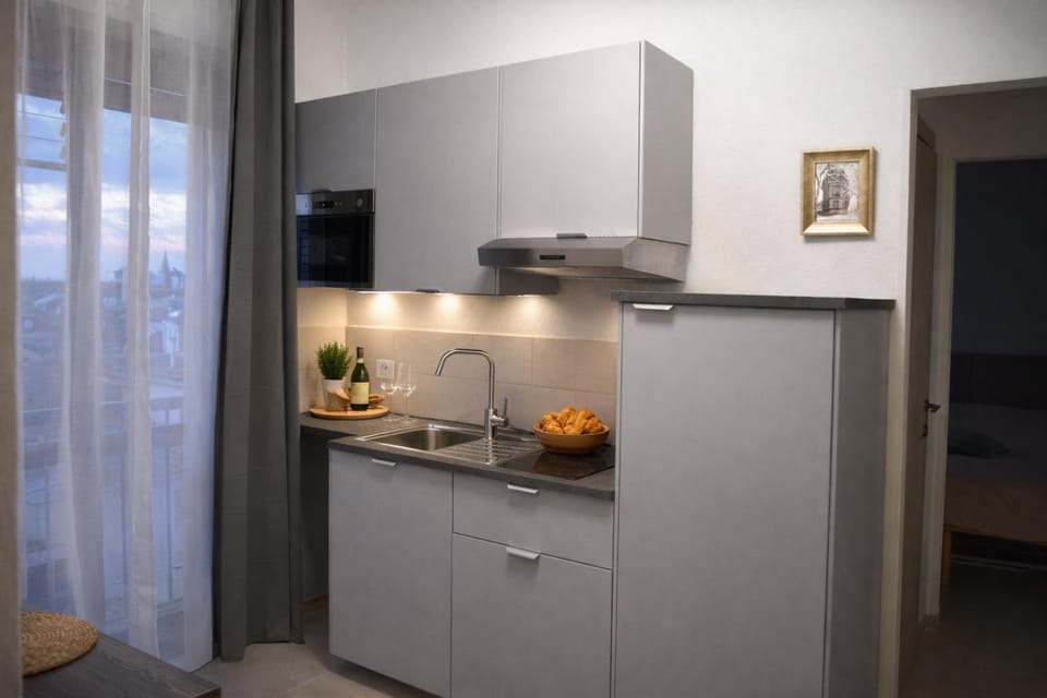 Kitchen or kitchenette, stove