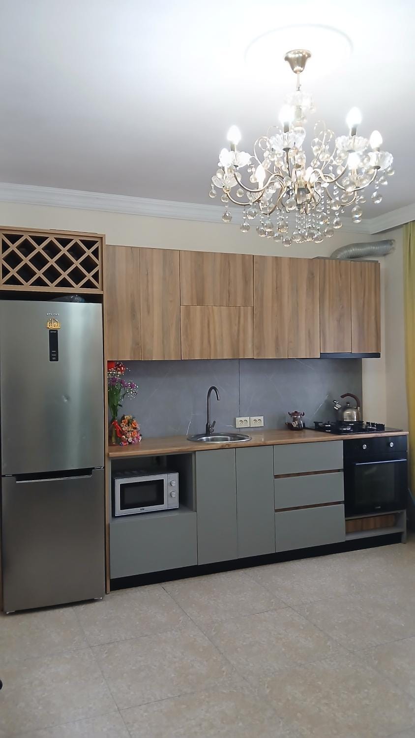 Kitchen or kitchenette, microwave, oven, stove