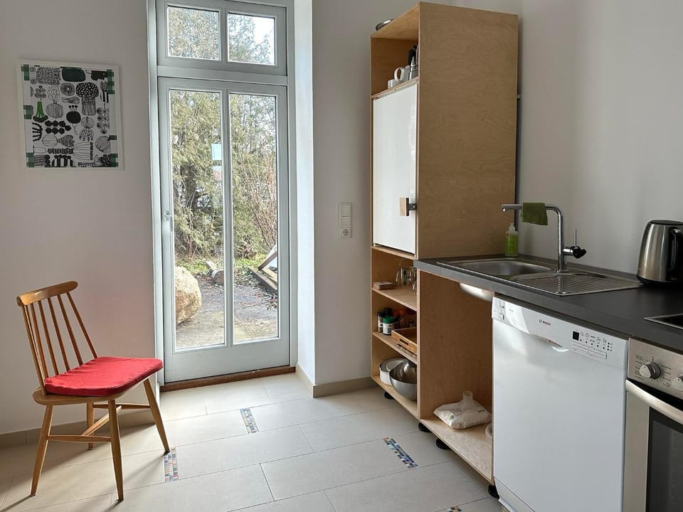 Kitchen or kitchenette, dishwasher, oven, stove
