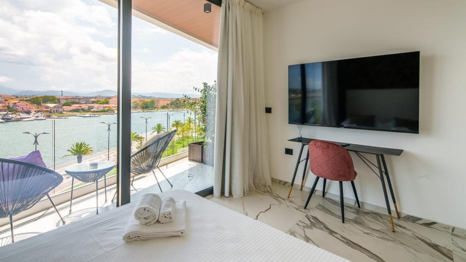 Welcomely - Deluxe Room vista mare Louis Armstrong Apartment in Olbia