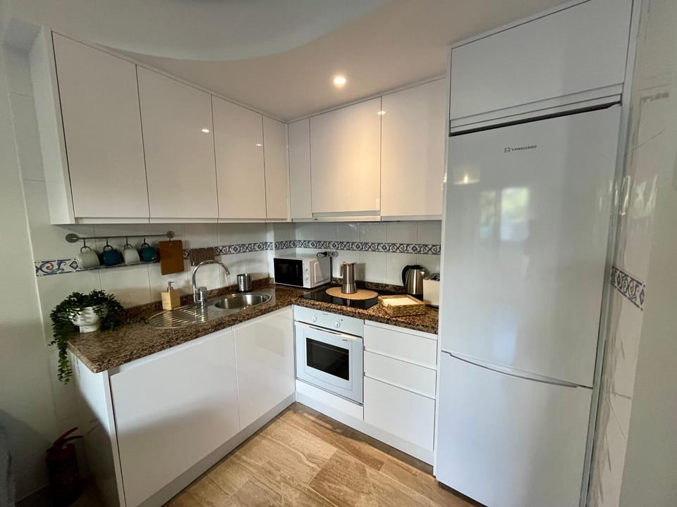 Kitchen or kitchenette, oven, stove, toaster