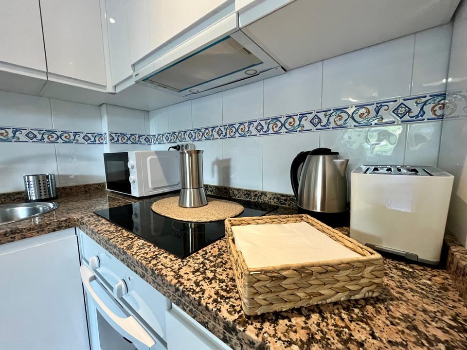 Kitchen or kitchenette, oven, stove, toaster