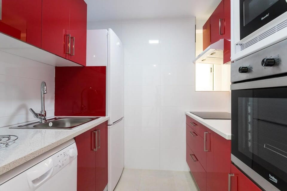 Kitchen or kitchenette, dishwasher, oven, stove