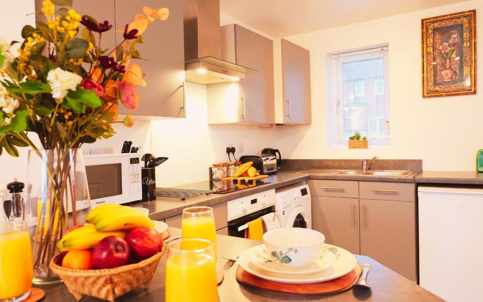 Kitchen or kitchenette, Dining area, microwave, oven, stove, toaster, washing machine, dryer