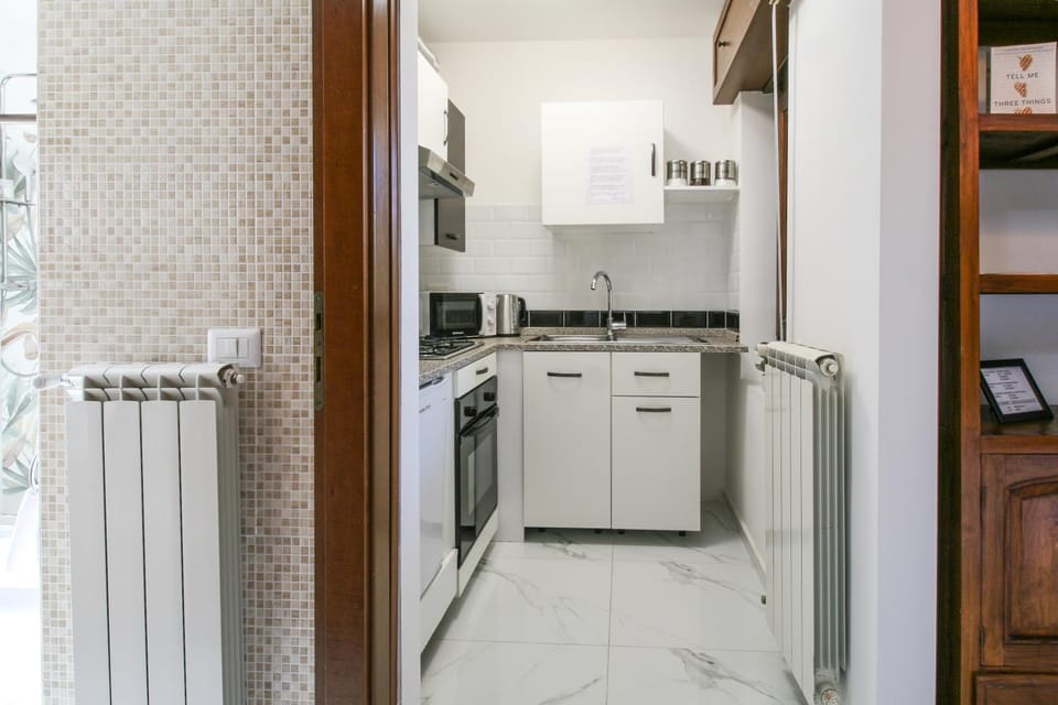 Kitchen or kitchenette, dishwasher, oven, stove