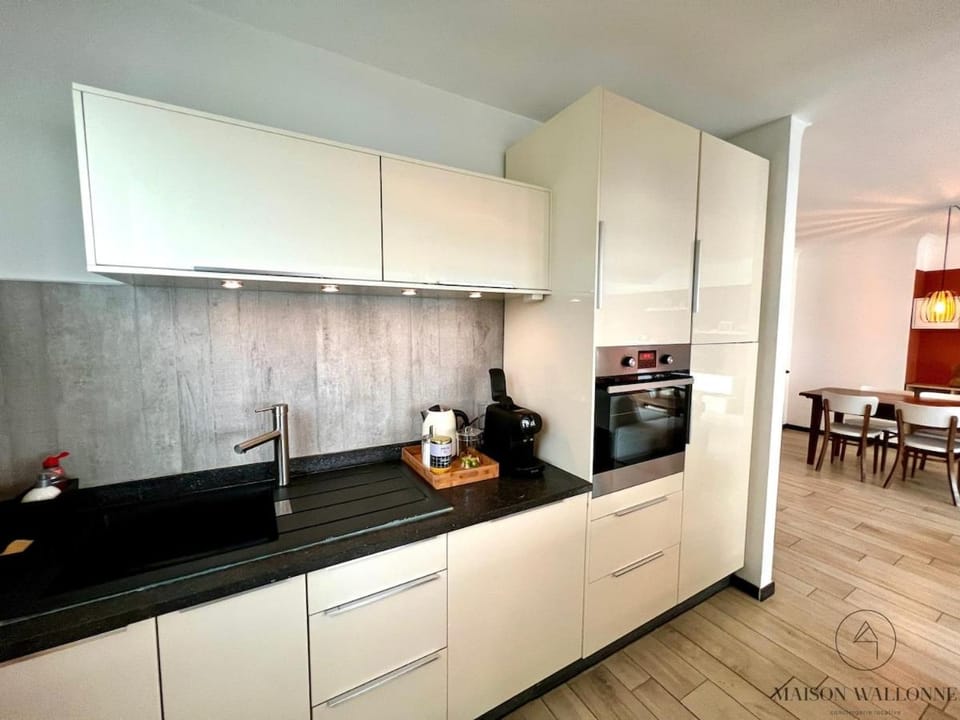 Kitchen or kitchenette, dishwasher, oven, stove