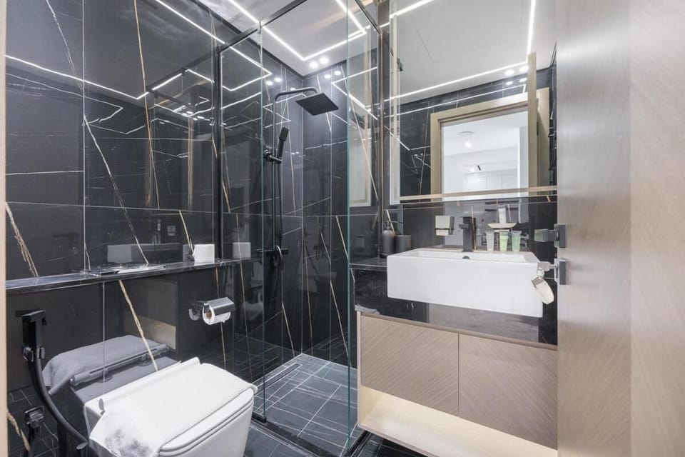 Free housekeeping visits during your stay - StayShort - Cozy 1-Bedroom Apartment Perfect for 4 in JVC Apartment in Dubai