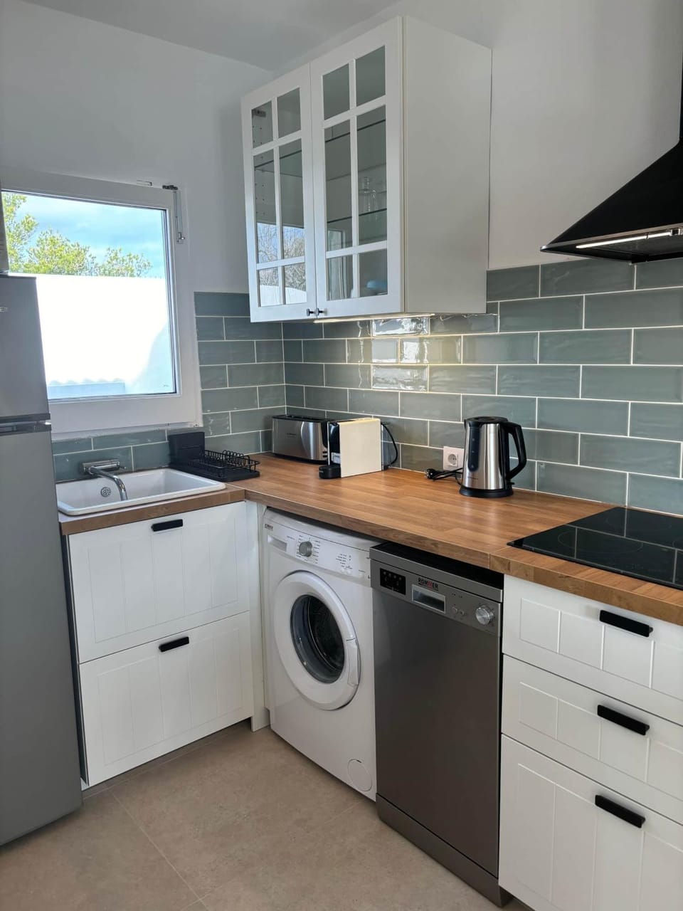 Kitchen or kitchenette, dishwasher, stove, toaster, washing machine