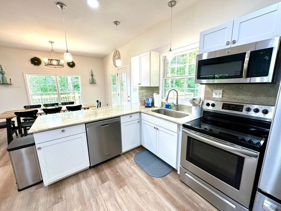 Kitchen or kitchenette, dishwasher, microwave, oven, stove, toaster