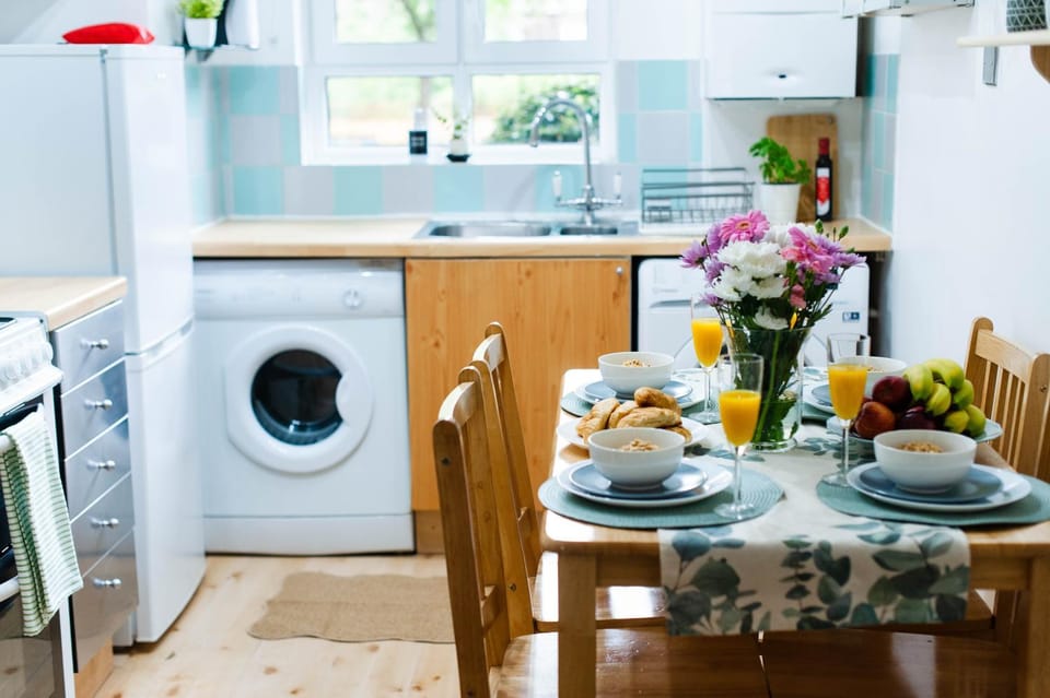 Kitchen or kitchenette, Dining area, oven, stove, toaster, washing machine, dryer