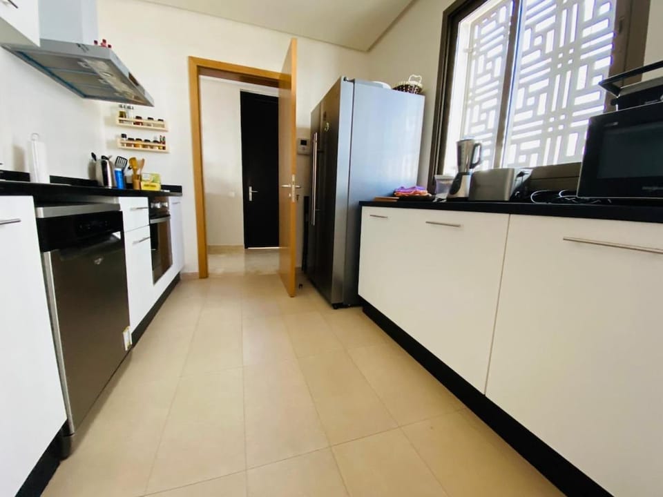 Kitchen or kitchenette, dishwasher, oven, stove