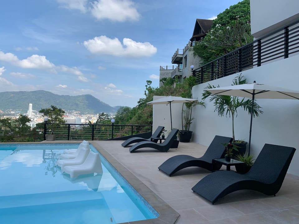 Property building, Patio, Day, Natural landscape, View (from property/room), Balcony/Terrace, Mountain view, Pool view, Swimming pool, sunbed
