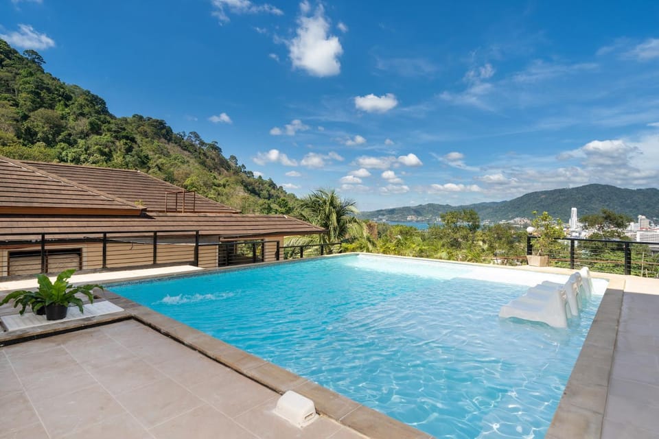 Property building, Day, Natural landscape, Mountain view, Pool view, Swimming pool, sunbed