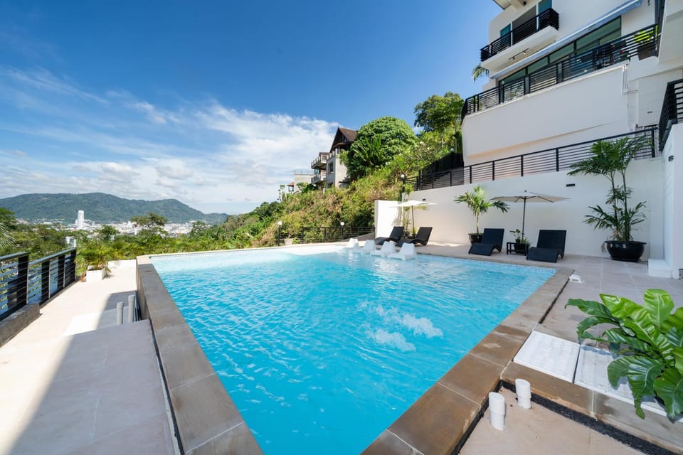 Property building, Patio, Natural landscape, View (from property/room), Balcony/Terrace, Mountain view, Pool view, Swimming pool, sunbed