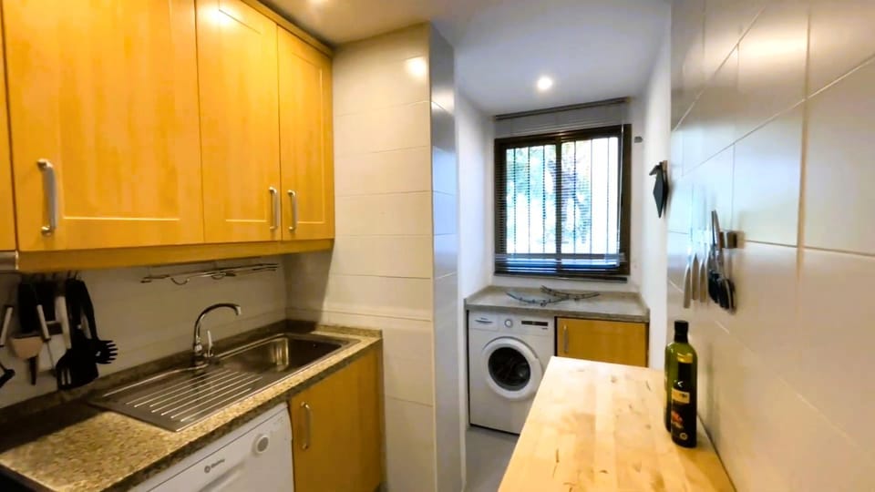 Kitchen or kitchenette, dishwasher, oven, stove, washing machine