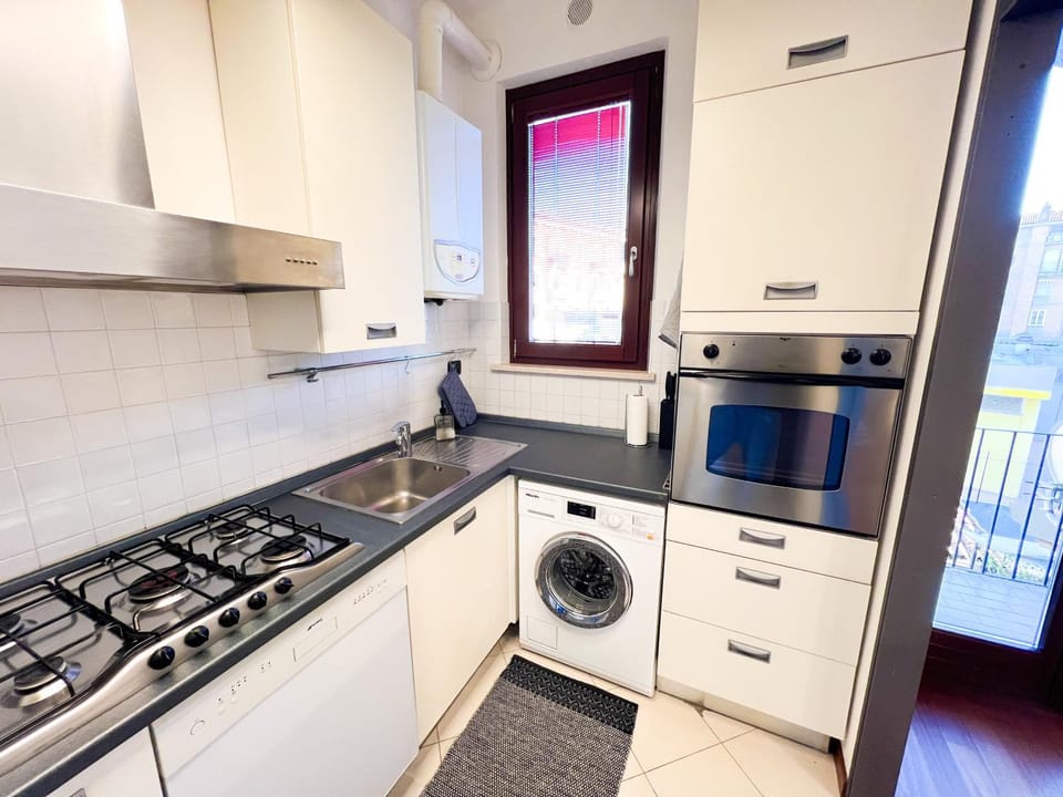 Kitchen or kitchenette, dishwasher, oven, stove, washing machine