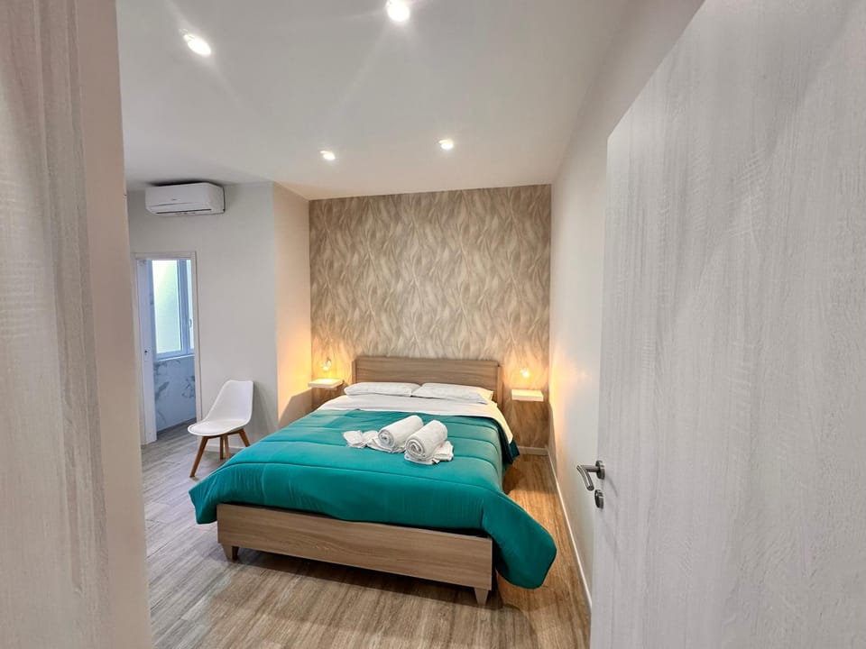 Bed, Photo of the whole room, Bedroom, towels, air conditioner