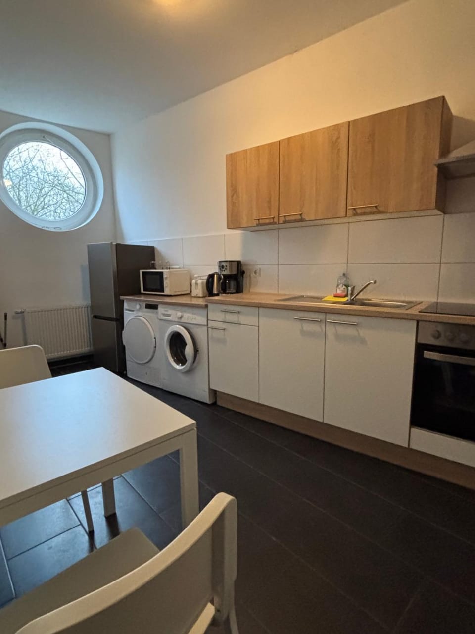 Kitchen or kitchenette, Dining area, oven, stove, toaster, washing machine, dryer